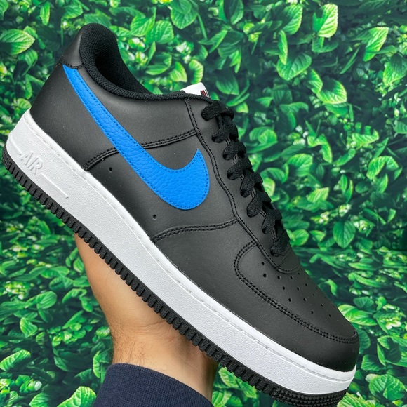black air forces with blue nike sign